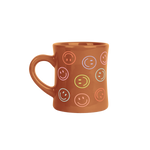 Brown colorful smiley faces around diner mug