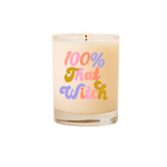 Candle rocks glass with text that reads "100% That Witch" in multicolor font on front of glass