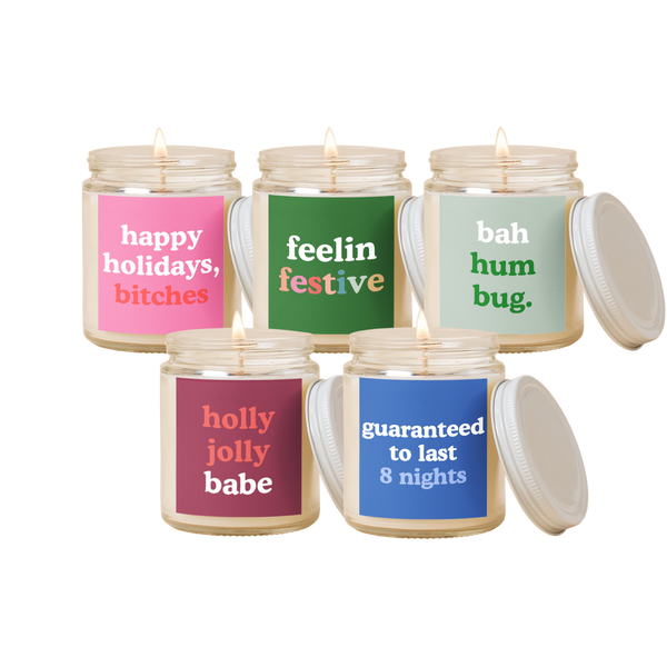 5 TOOT Holiday Candle Jars. Each different colors and phrases.