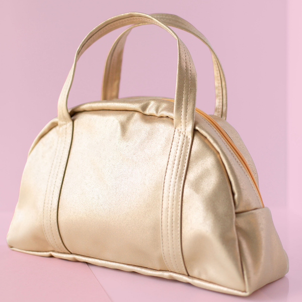 Cute handbag in gold metallic vegan leather and a zippered top.