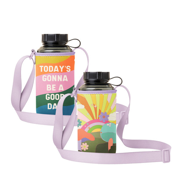 "Todays gonna be a good day" text on a colorful rainbow wave with a purple strap. Reversible side is a colorful rainbow in the background with white, yellow and orange rays in a neon background with colorful flowers and teal and orange mushroom on green grass towards the front.