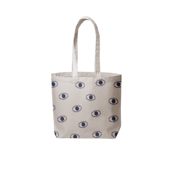 a grey canvas tote bag with blue eyeballs