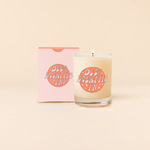 Rocks glass candle reading "DEEP BREATHS IN" in pastel pink with star backdrop. Box packaging in pastel pink with same text as candle. 