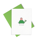 Happy Belated is a cute birthday card of a little turtle with a pink gift on his back and wearing a pink party hat.