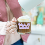 a girl holding a cute glass mug that says exhale the bullshit in purple