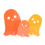 Small, medium, and large acrylic ghosts in shades of orange.