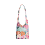 A pale blue colored bagabond crossbody tote with cranberry, orange, teal and pink fall floral leaves