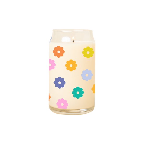 A 16 oz. candle with multicolored daisies printed all around the candle.