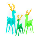 three acrylic reindeer blue, green and light green with golden antlers.