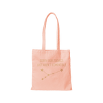 A Pink-toned colored canvas tote bag with the phrase "Sorry our Zodiacs just aren't compatible" printed on the front. A constellation of stars in printed underneath the phrase.