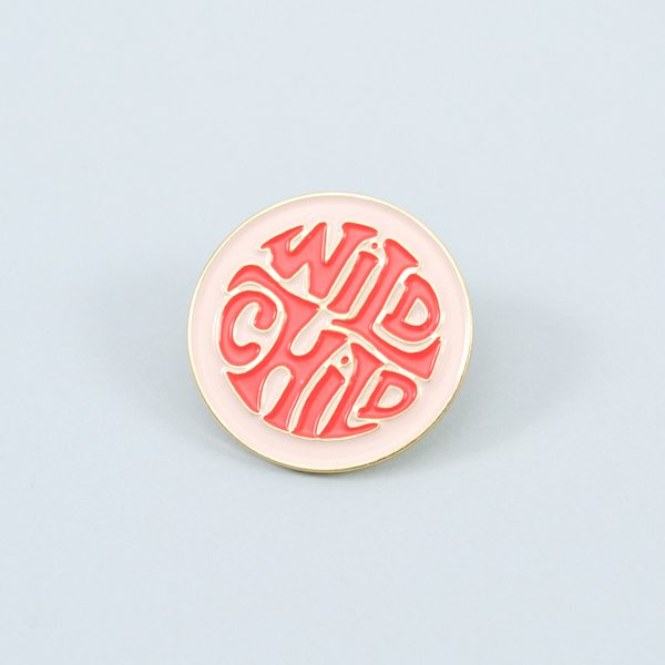 wild child enamel pin on a blue background