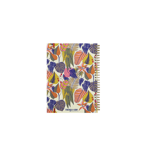 A mint colored notebook cover with multicolored and differently designed leaves.