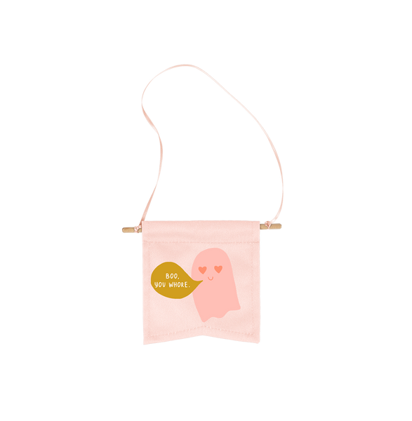 light pink small canvas wall flower with pink ghost with heart eyes and mustard green gold text bubble with "boo, you Whore." written in it. 