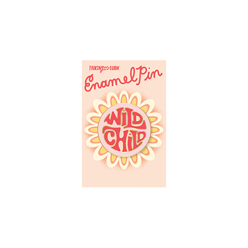 a cute circle enamel pin that says wild child